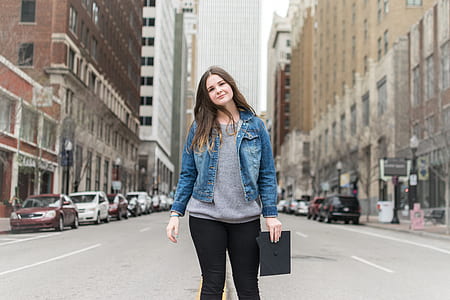 woman standing on center road thumbnail