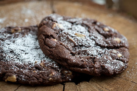 two chocolate cookies with sugar powder thumbnail
