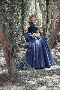 Woman in Black Floral Gown Sitting thumbnail