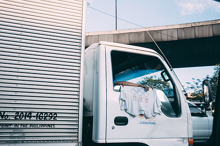 white delivery truck with textile on door thumbnail