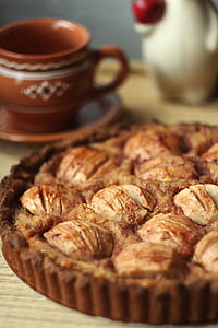 cooked food on brown surface beside mug thumbnail