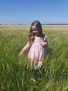 girl standing on grass field thumbnail