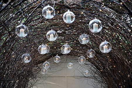 hanging candle lanterns on arched pathway thumbnail