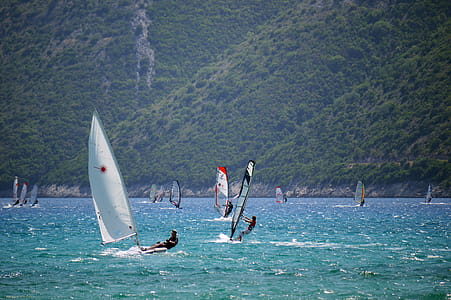 Man in Black Top Ridding Sailboat thumbnail