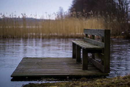 brown wooden bench on wooden dock thumbnail