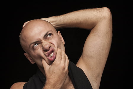 man squeezing his cheeks thumbnail