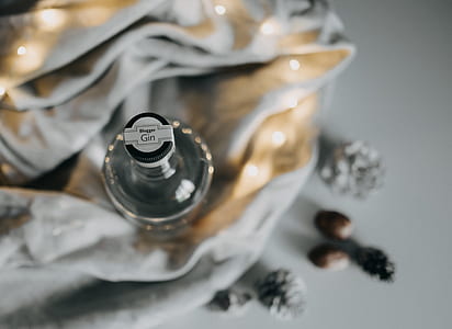 tilt shift lens photography of clear glass bottle thumbnail