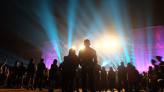 silhouette of people standing near stage thumbnail