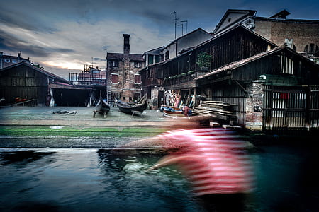 two boats beside house near body of water thumbnail