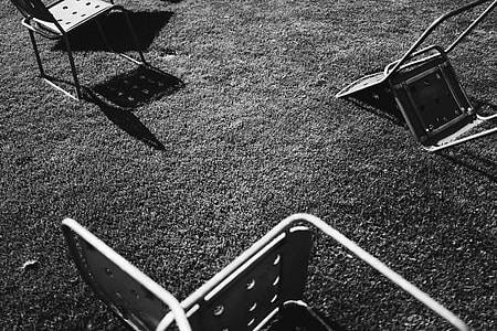 gray scale of three steel chair on ground thumbnail