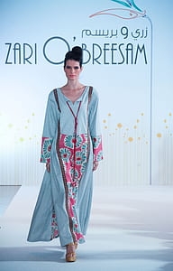 woman in blue and pink floral long dress thumbnail