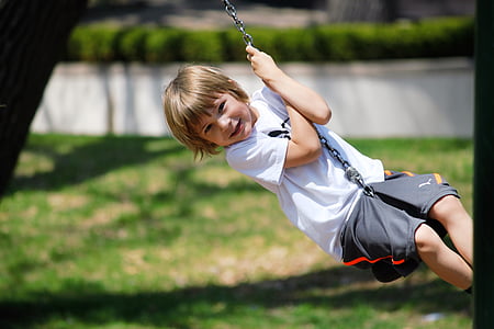 boy in white crew-neck shirt and black shorts thumbnail