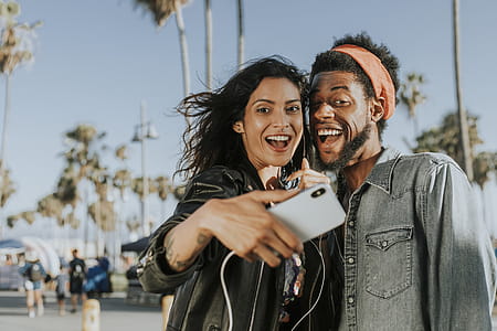 Photo of Man and Woman Taking Selfie thumbnail