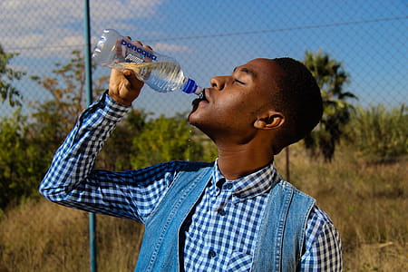 Photography of A Man Drinking Water thumbnail