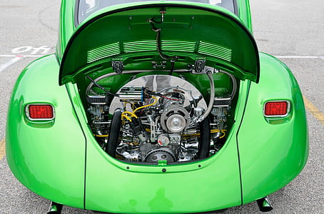 close up photo of green car engine bay thumbnail
