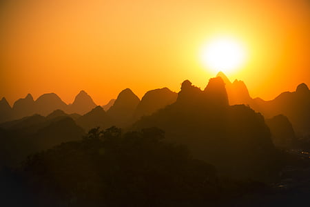 silhouette of mountains during sunset thumbnail