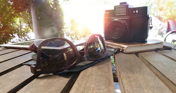 wood, sunglasses, camera, table thumbnail