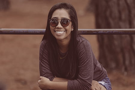 woman wearing brown long-sleeved shirt thumbnail