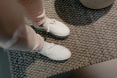 A woman in white flatform sneakers thumbnail
