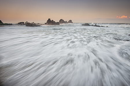 time lapse photography of body of water waves thumbnail