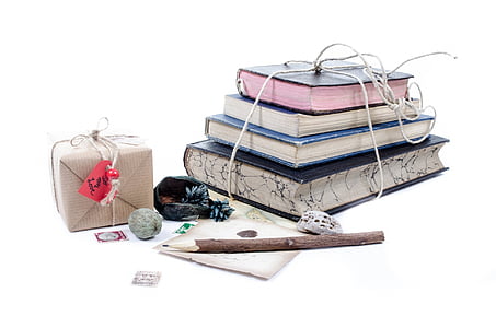 photo of pile of books near pencil thumbnail