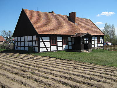 white and brown bungalow house under blue clear sky thumbnail