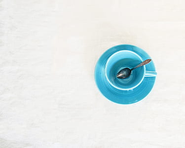 silver spoon on drinking cup thumbnail