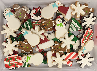 assorted-shape Christmas-themed cookies on tray thumbnail
