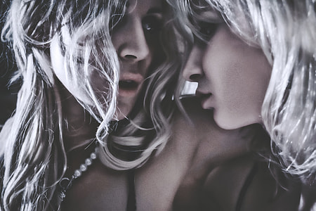 portrait photo of two women wearing black spaghetti strap tops thumbnail