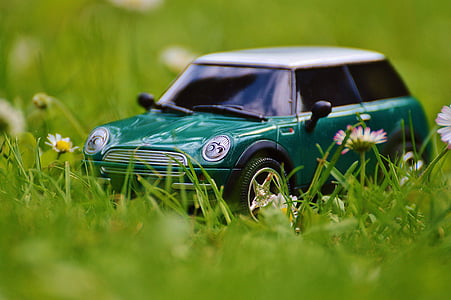 closeup photo of green Mini Cooper scale model on green grass thumbnail