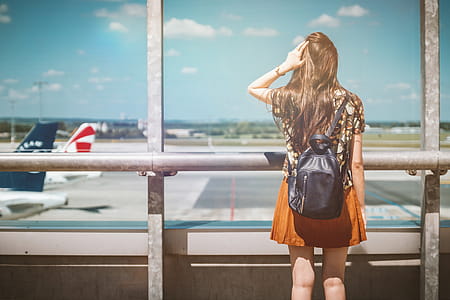 Vacation is beginning. Young female passenger at the airport. thumbnail