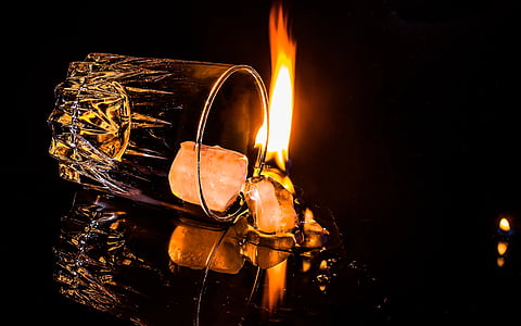 two clear shot glasses with fire thumbnail