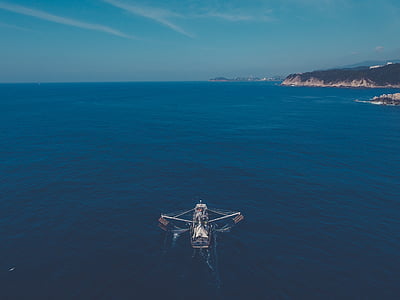aerial view photography of boat thumbnail