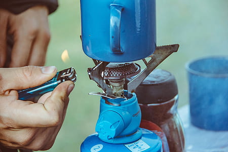 person lighting camping burner thumbnail