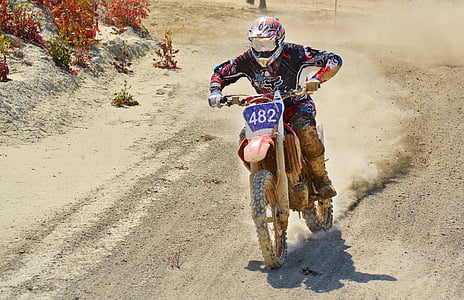 man rides red dirt bike thumbnail