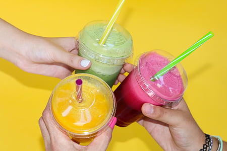 person holding fruit drinks thumbnail