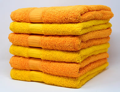 pile of orange and yellow towels thumbnail