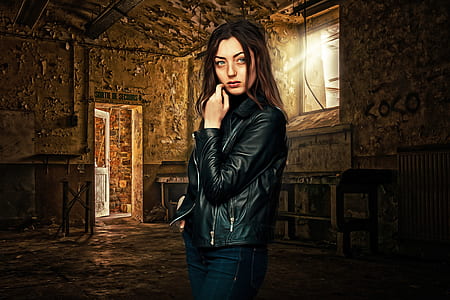 woman looking at camera inside of building thumbnail
