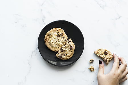 Two Cookies on Black Ceramic Plate thumbnail