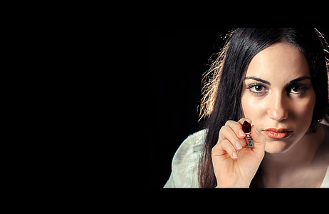 woman holding black lipstick thumbnail
