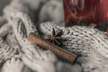 cinnamon stick on white crochet textile thumbnail