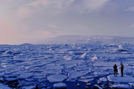 two person at frozen body of water thumbnail