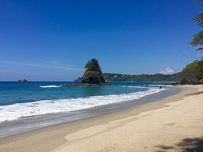 shore near ocean under blue clear sky during daytime thumbnail