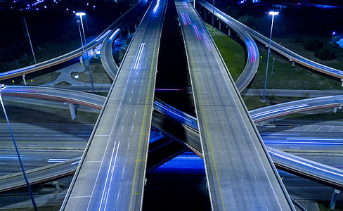 time lapse photography of moving vehicles on road thumbnail