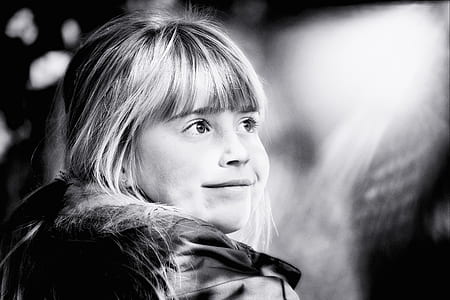 grayscale photo of girl wearing jacket thumbnail