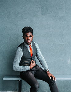 man wearing gray dress shirt and vest thumbnail
