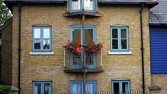 brown brick house during daytime thumbnail