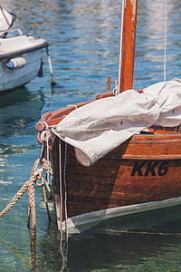 White Textile on Brown Boat thumbnail