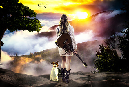 Jack Russell Terrier beside woman in white floral lace long-sleeve mini dress holding guitar walking on road during sunset thumbnail
