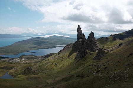 photography of mountain near river at daytime thumbnail